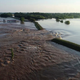 A breached levee on the Arkansas River, a common sight this spring.
